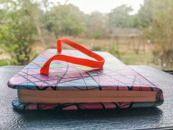 Close-up of red car on table