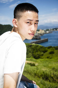 Portrait of young man on shore