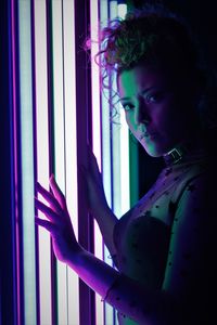 Model with pin up hairstyle with neon lights