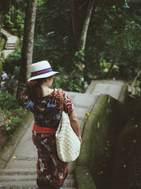 Rear view of woman walking outdoors