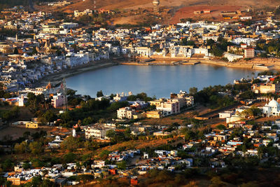 High angle view of residential district surrounding lake