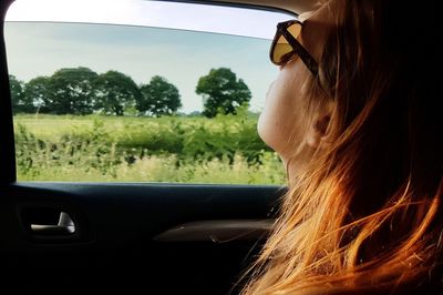 Young woman traveling in car