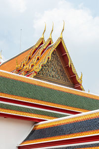 Low angle view of temple roof against sky
