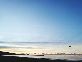 Scenic view of landscape against blue sky