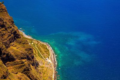 High angle view of sea against blue sky