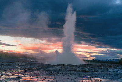 View of sea against cloudy sky during sunset