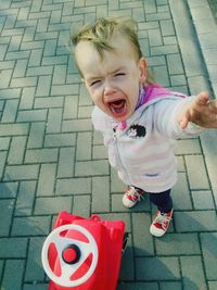 Cute boy playing with ball