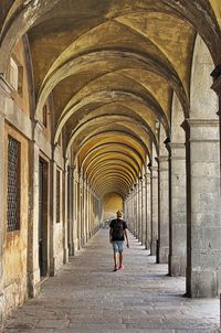 Woman walking in corridor