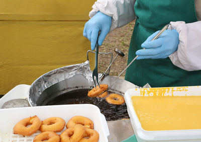 Midsection of person preparing food