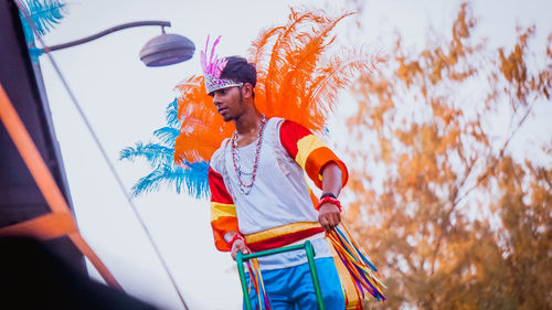 Low angle view of young man in costume