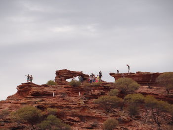 People on rock formation