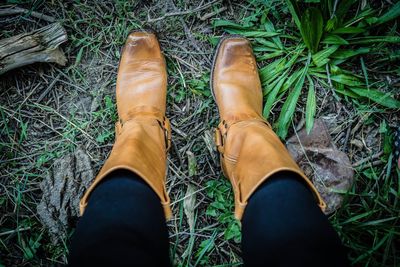 Low section of woman wearing leather boots