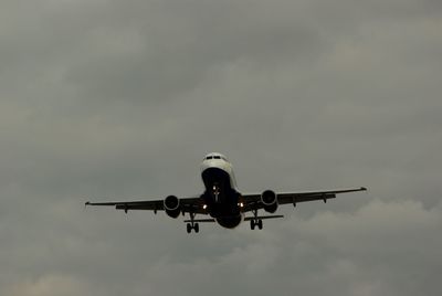 Low angle view of airplane against sky