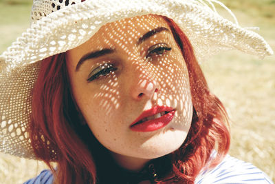 Close-up of woman wearing hat