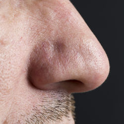 Close-up of man over black background