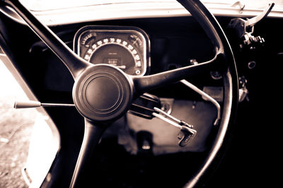 Close-up of steering wheel in car