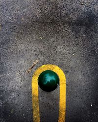 Close-up of yellow lines on road