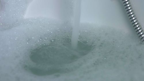 Close-up of drinking glass in water