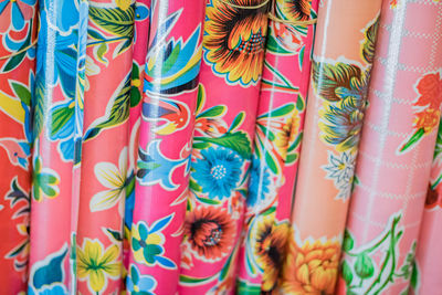 Full frame shot of multi colored wallpaper rolls in market