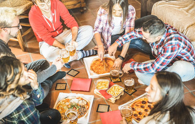 High angle view of people eating food on table