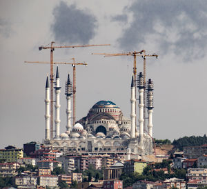 Buildings in city against sky