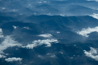 Aerial view of clouds over mountains