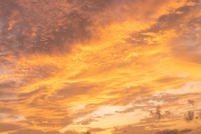 Low angle view of dramatic sky during sunset