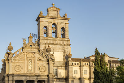 Low angle view of historical building against clear blue sky