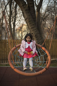 Full length of girl in playground at park