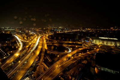 High angle view of illuminated cityscape at night