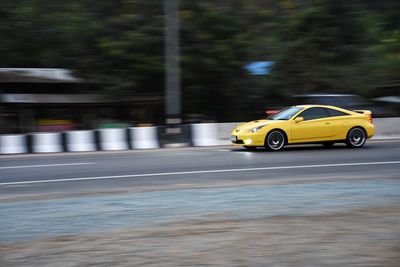 Blurred motion of car on road