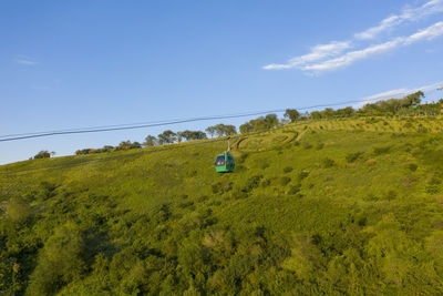 Scenic view of landscape against blue sky