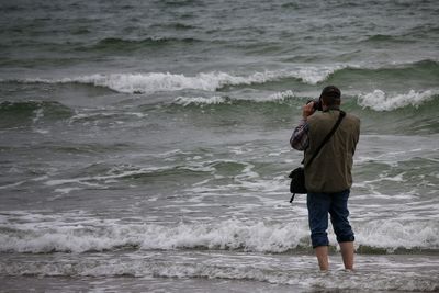 Man jumping on shore