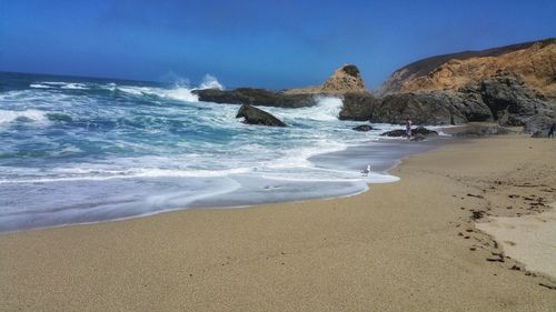 Scenic view of beach against sky