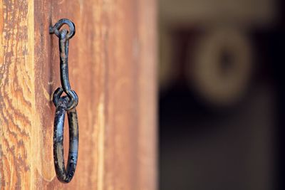 Close-up of chain hanging on door