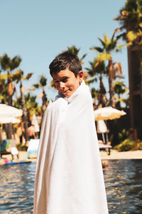 Portrait of man standing in swimming pool