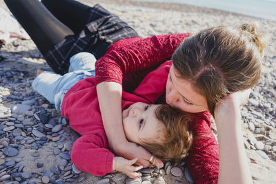 Full length of woman lying down on floor