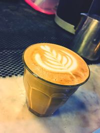 High angle view of cappuccino on table