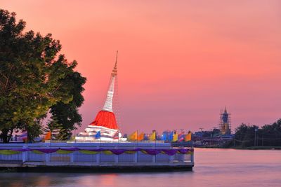View of tower in city during sunset