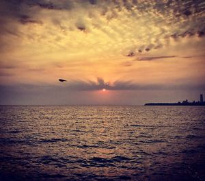 Scenic view of sea against sky during sunset