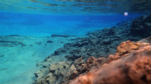 Rocks in sea at night