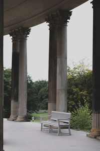 Empty chairs and tables against clear sky