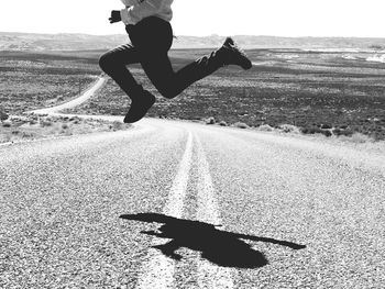 Man jumping on road