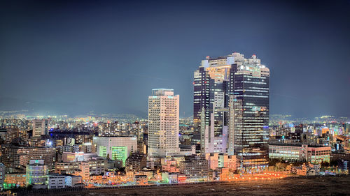 Illuminated cityscape at night