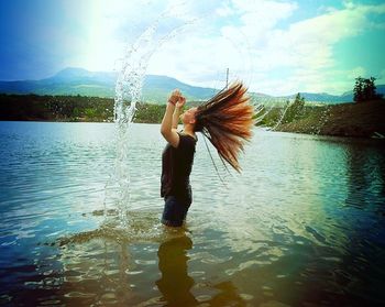 Woman standing in lake