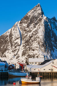 Scenic view of snowcapped mountains against clear blue sky