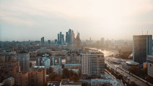 High angle view of modern buildings in city against sky