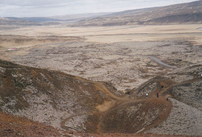 High angle view of hikers at volcanic landscape