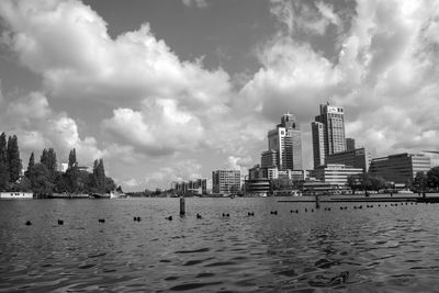 Panoramic view of sea and buildings against sky
