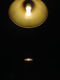 Low angle view of lit lamp